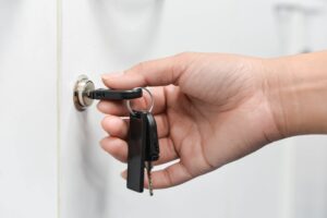 A Man Locking the Door of His House Using the Keys in Vancouver, BC