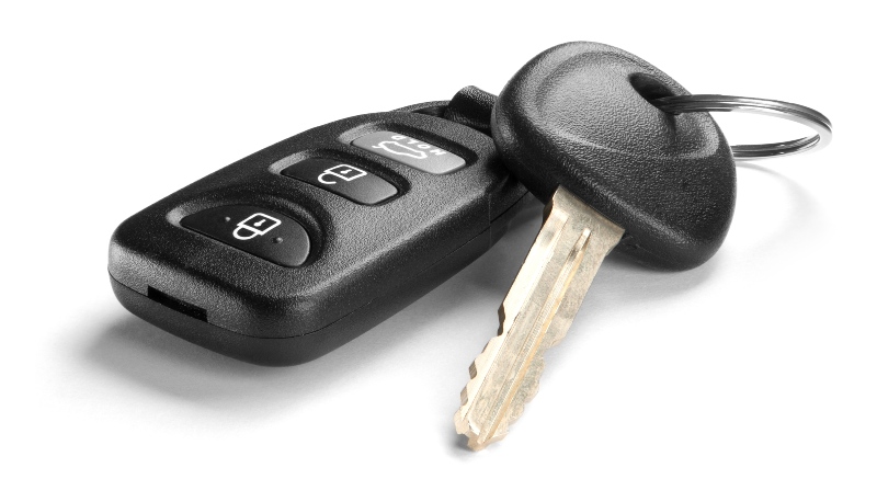 Black car key and remote on white background in Vancouver
