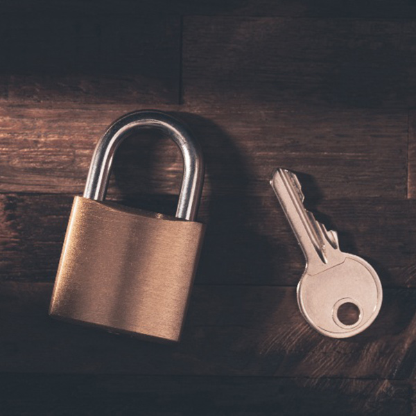 Lock and key on brown table in Vancouver, BC