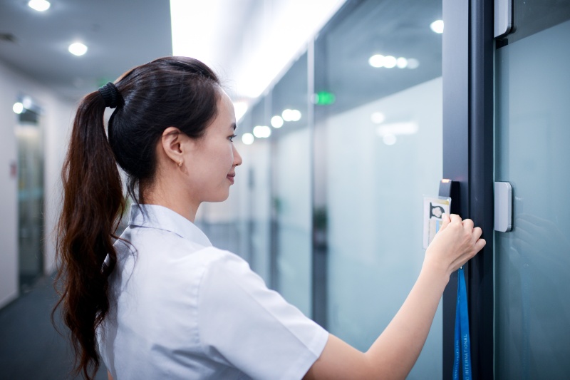 Businesswoman Opening Office Door