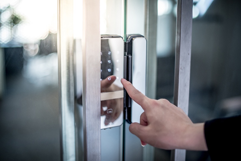 Pressing buttons on electronics access control or digital lock in Vancouver, BC